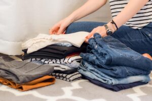 a woman folding clothing